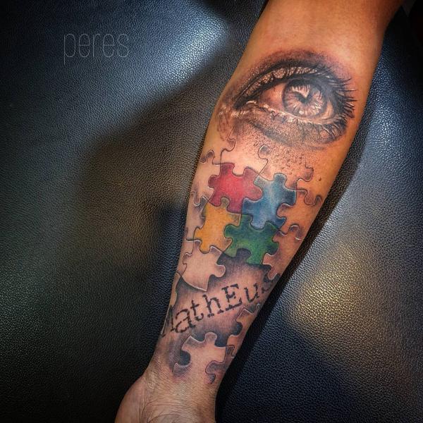 Puzzles and realistic eye tattoo