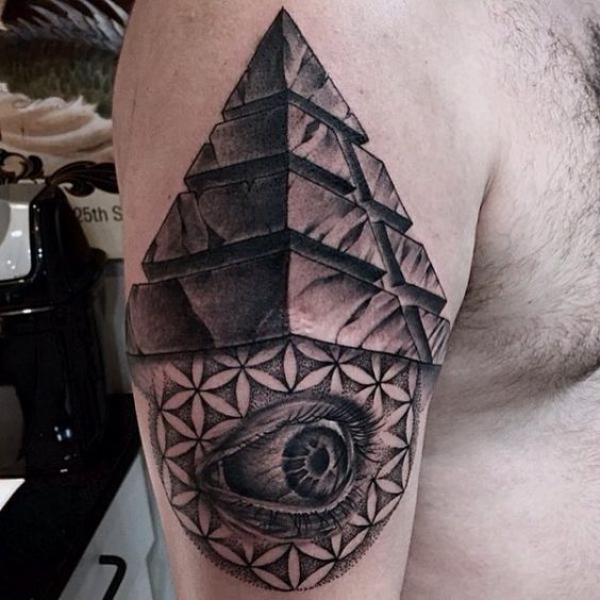 Pyramid and eye with flower of life tattoo