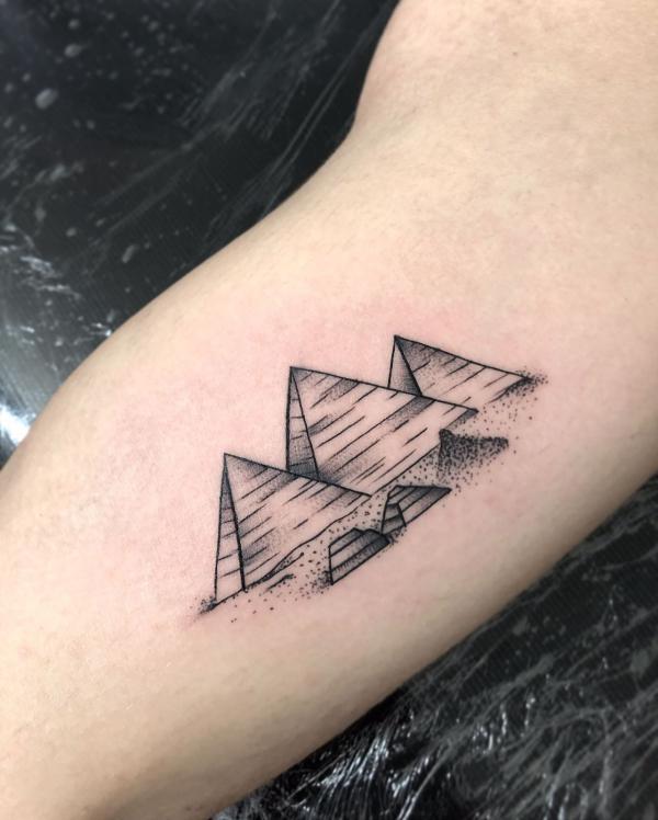 Pyramids bicep tattoo