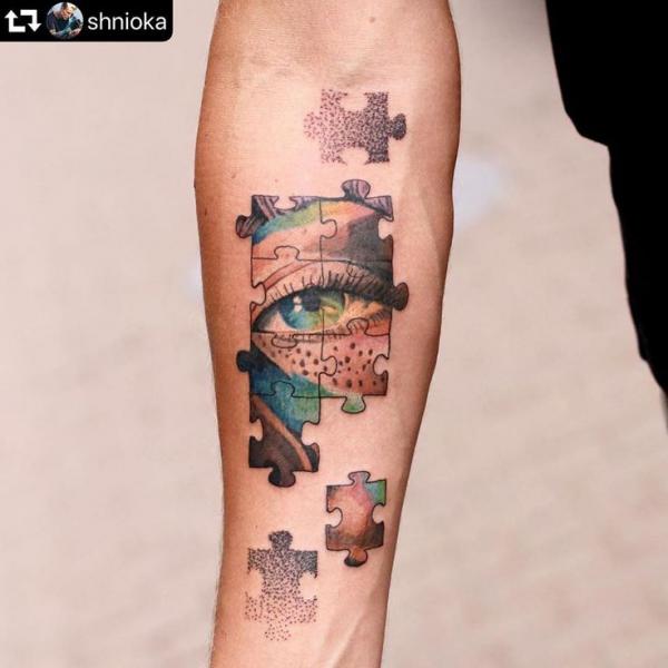 Realistic eye and dotwork puzzles tattoo