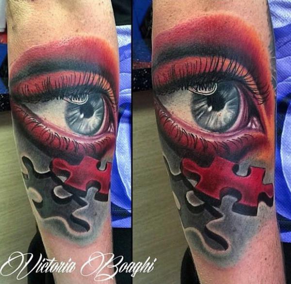Realistic eye and missing puzzle tattoo