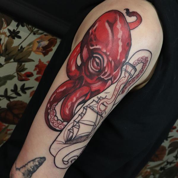 Red kraken with ship line work tattoo