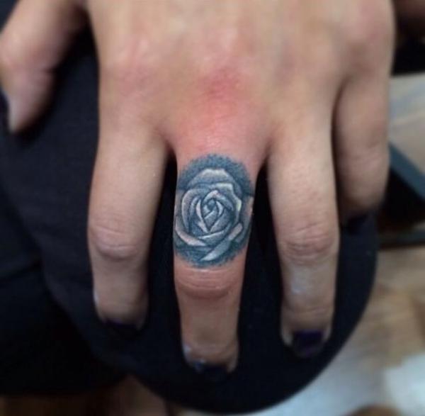 Rose finger tattoo black and grey