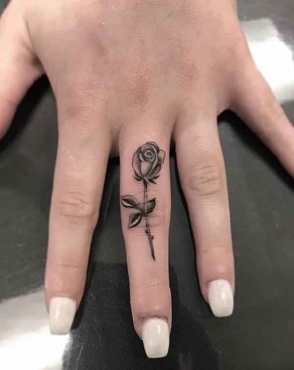 Rose middle finger tattoo black and grey