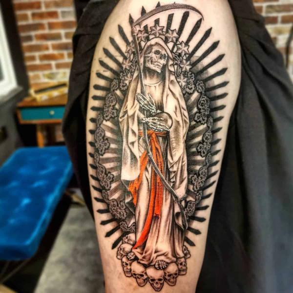 Santa Muerte holding scythe and globe tattoo sleeve