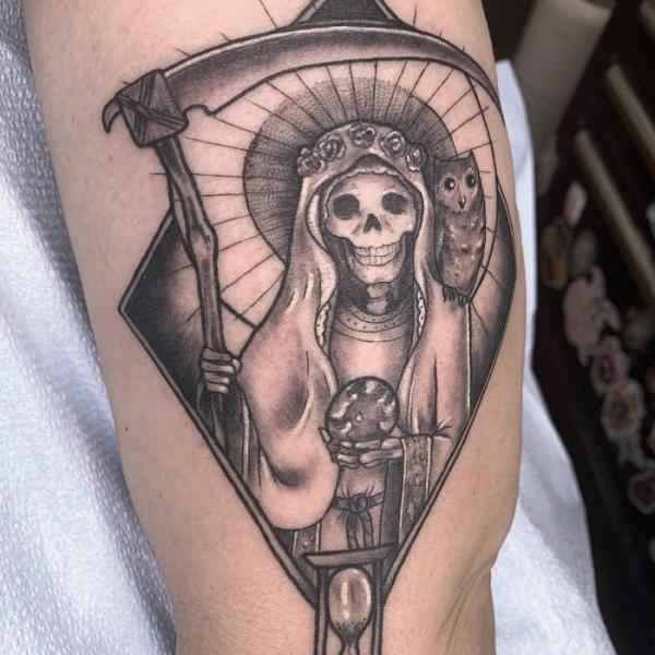 Santa Muerte holding scythe and globe with owl tattoo black and grey
