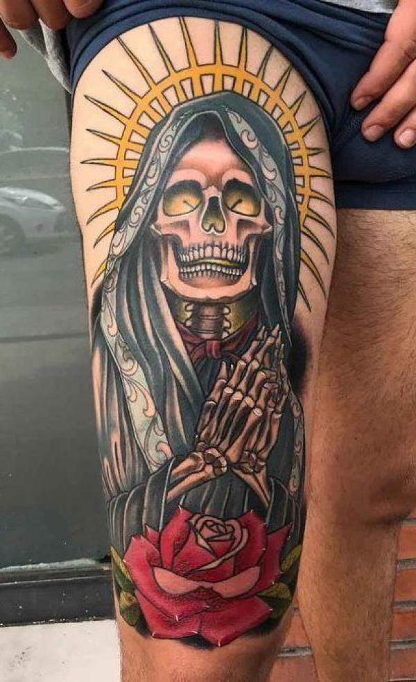 Santa Muerte with praying hands and rose thigh tattoo