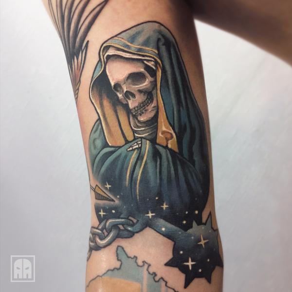 Santa Muerte with stars bicep tattoo