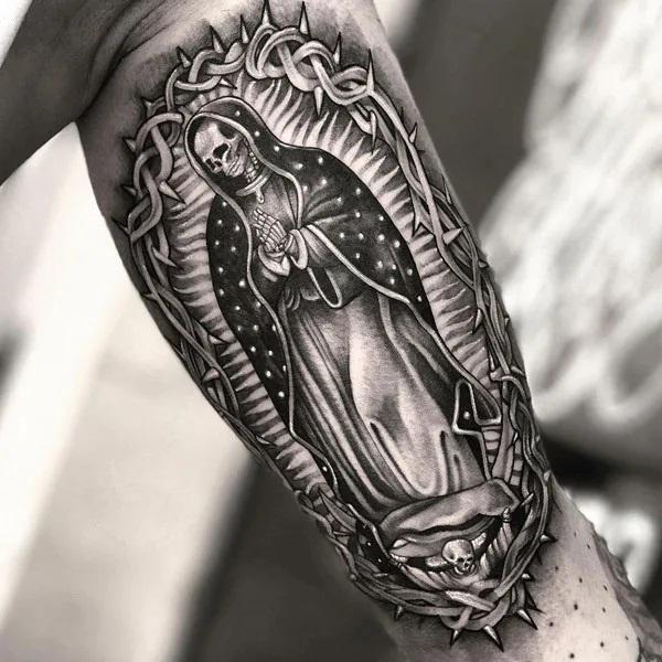 Santa muerte bicep tattoo