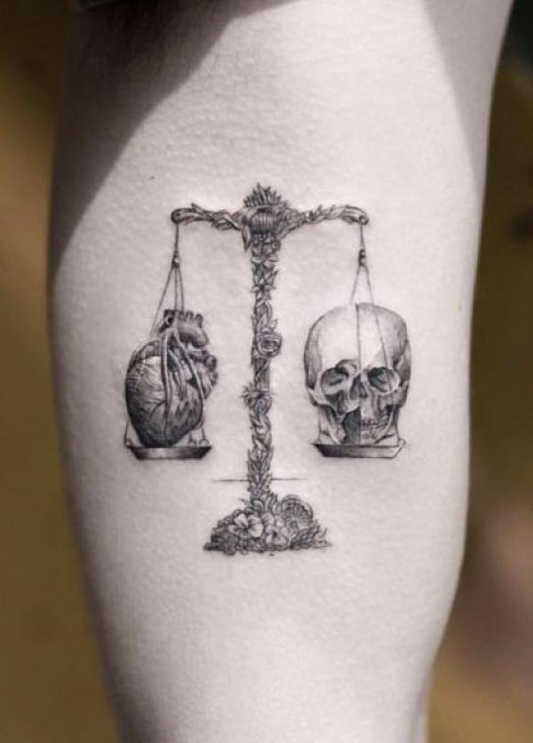 Scales of justice with heart and skull tattoo black and grey