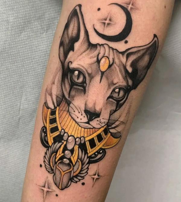 Scarab beetle and Bastet with moon and stars tattoo