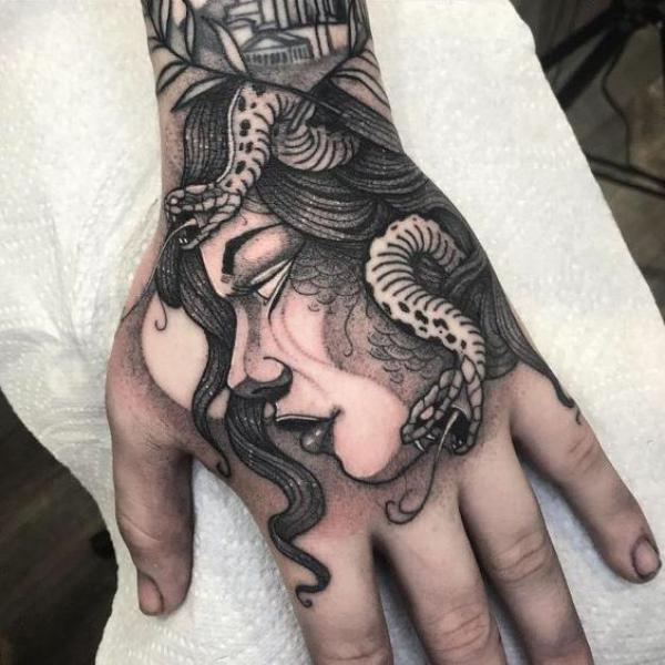 Side view Medusa portrait hand tattoo