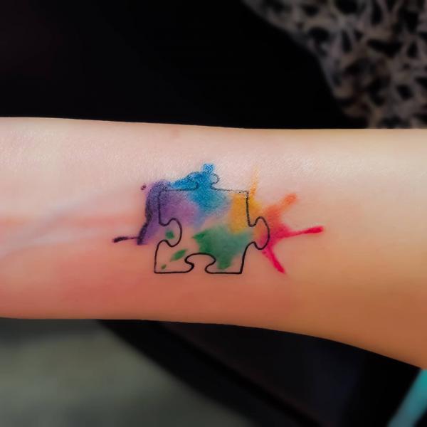 Single watercolor puzzle piece tattoo watercolor