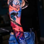 Skiing with mountains and snowflake tattoo