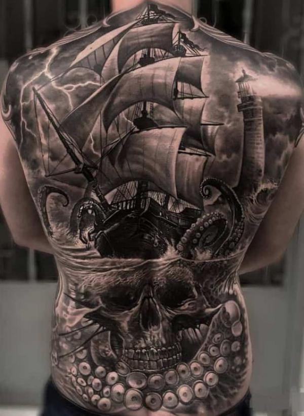 Skull ship with kraken tentacles and lighthouse full back tattoo