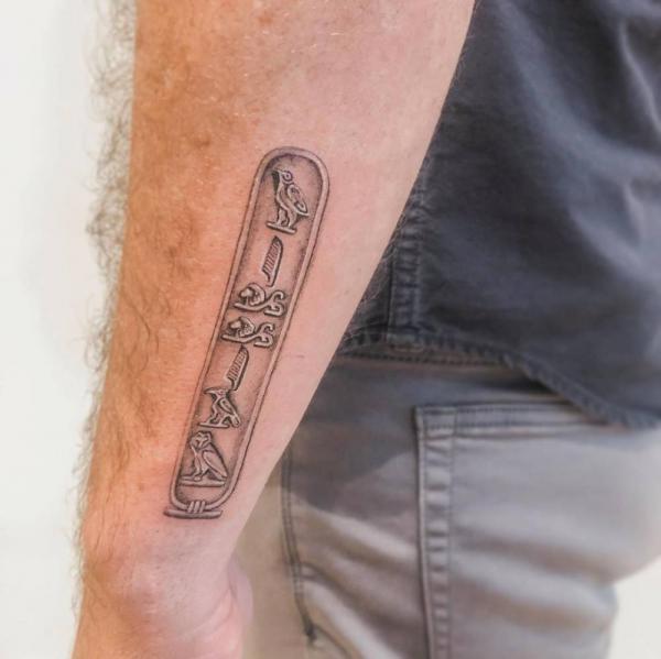 Small Cartouche Hieroglyphics tattoo on outer of forearm