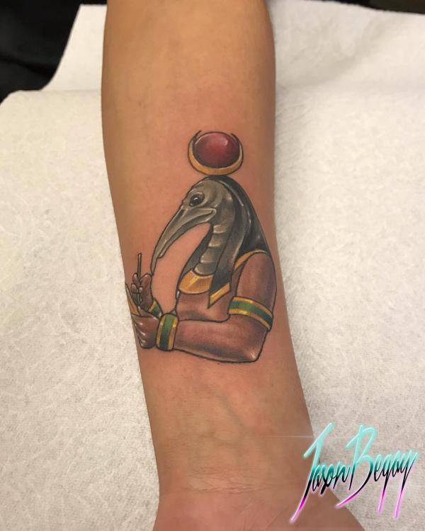 Small Thoth portrait tattoo