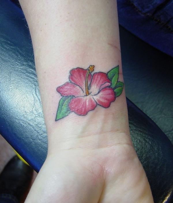 Small hibiscus wrist tattoo