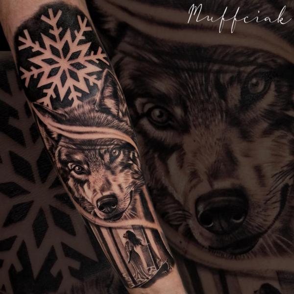 Snowflake and wolf tattoo