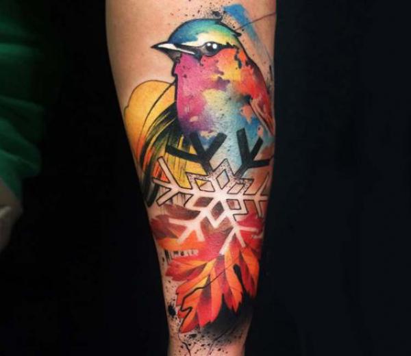 Snowflake fall leaf and bird tattoo