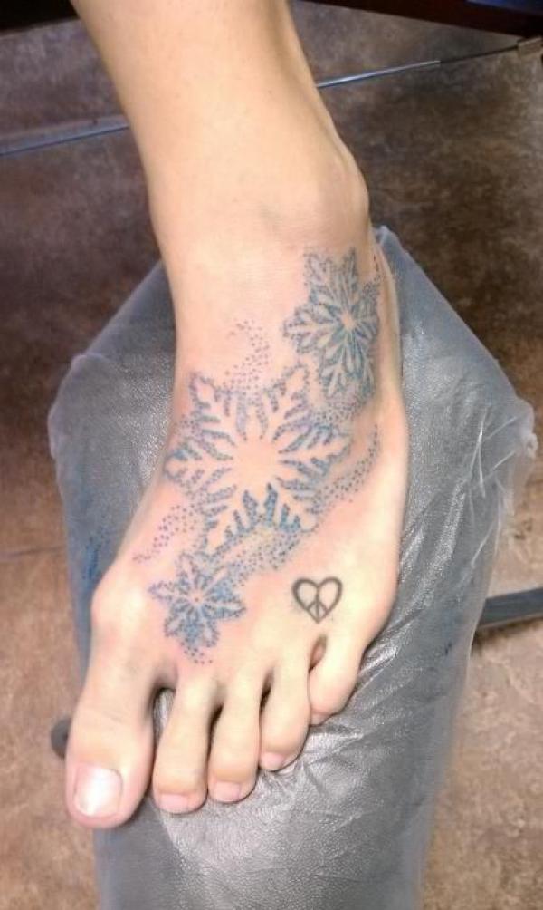 Snowflake foot tattoo black and grey