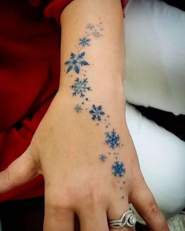 Snowflake hand tattoo