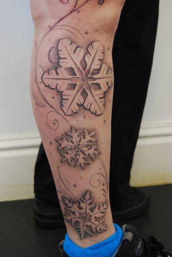 Snowflake lower leg tattoo