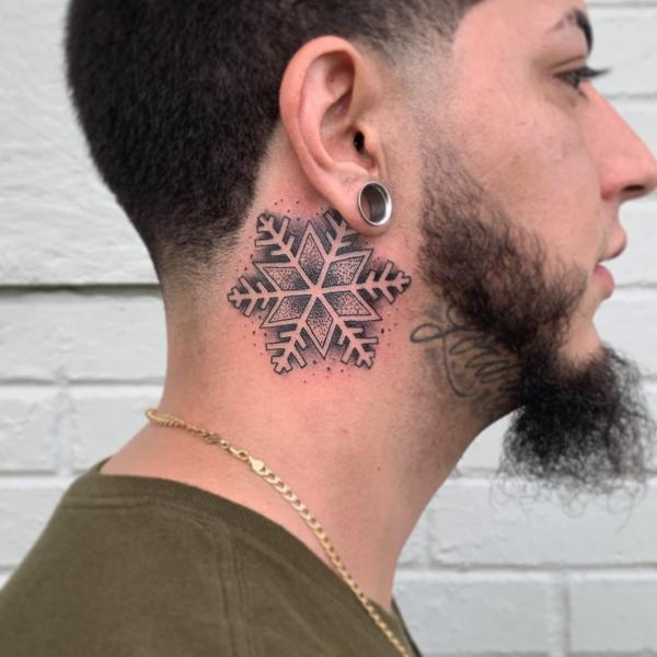 Snowflake neck tattoo