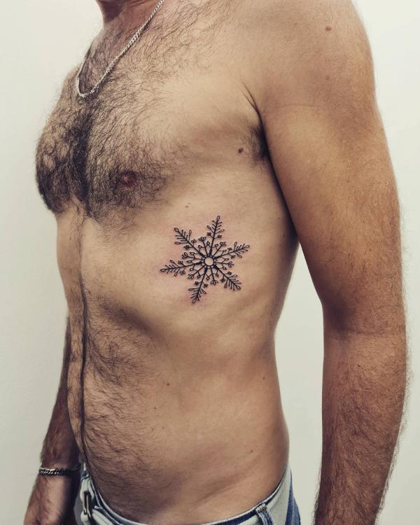 Snowflake side tattoo