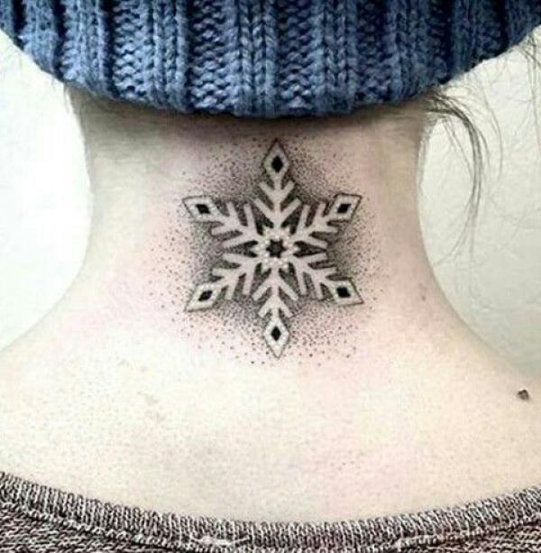 Snowflake tattoo on back of neck