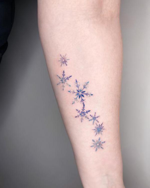 Snowflake tattoo on forearm