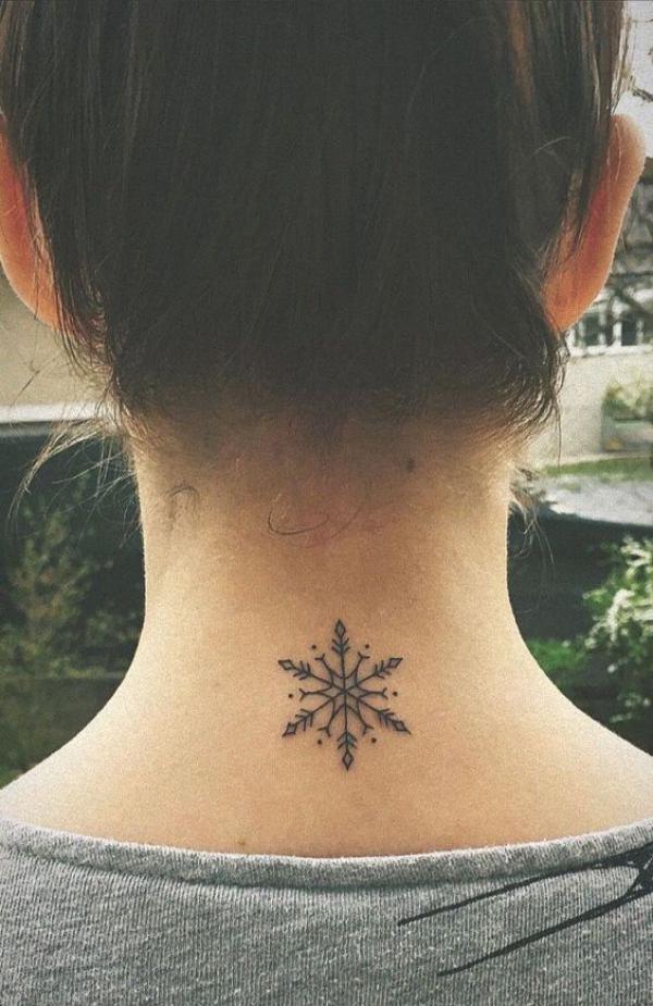 Snowflake tattoo on the back of neck