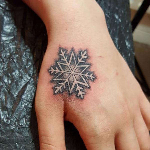 Snowflake thenar web space tattoo