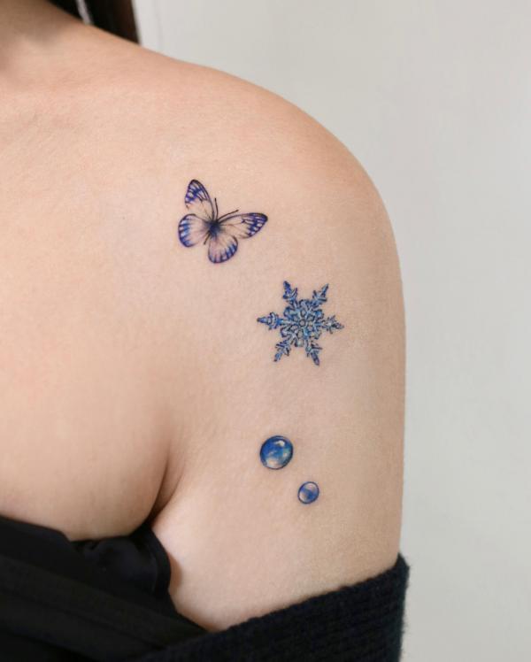 Snowflake water drops with butterfly tattoo on shoulder