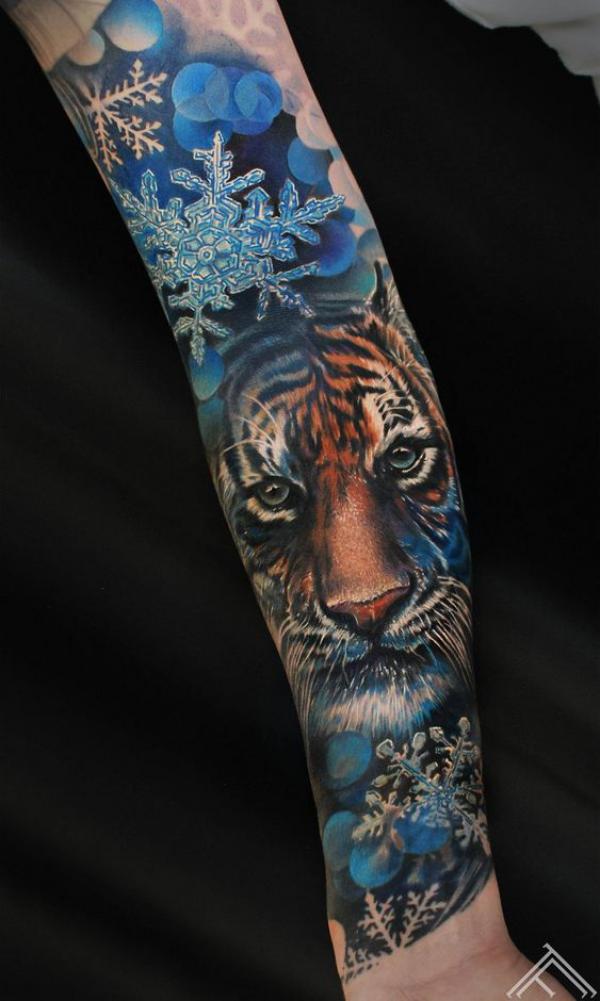 Snowflakes and tiger tattoo