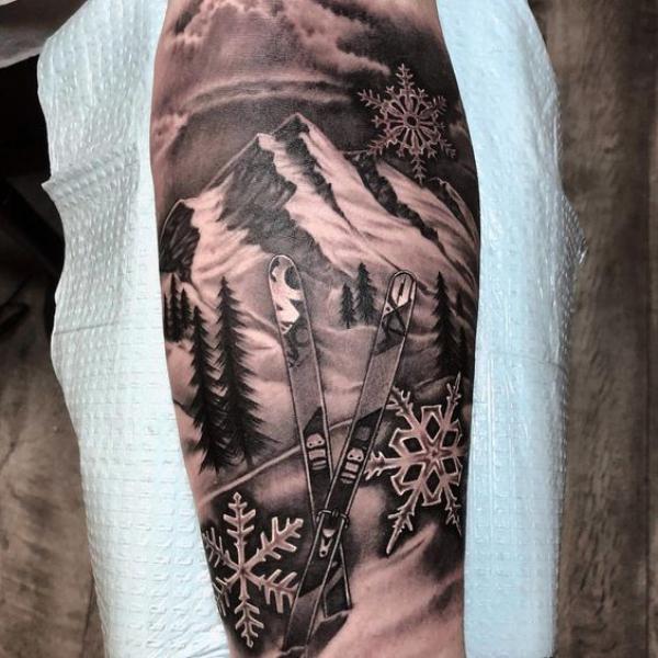 Snowflakes skis and snow mountain tattoo