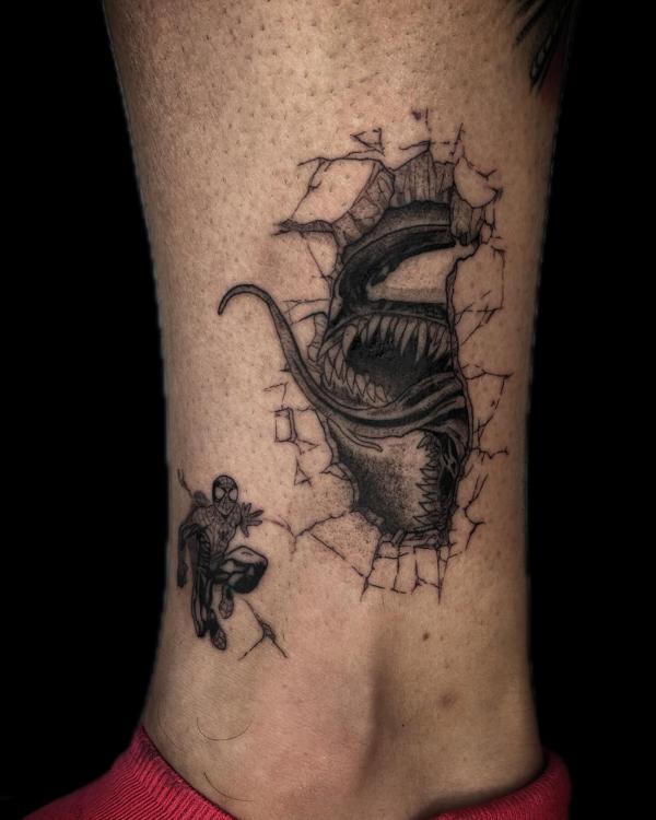 Spiderman and venom with spider web tattoo