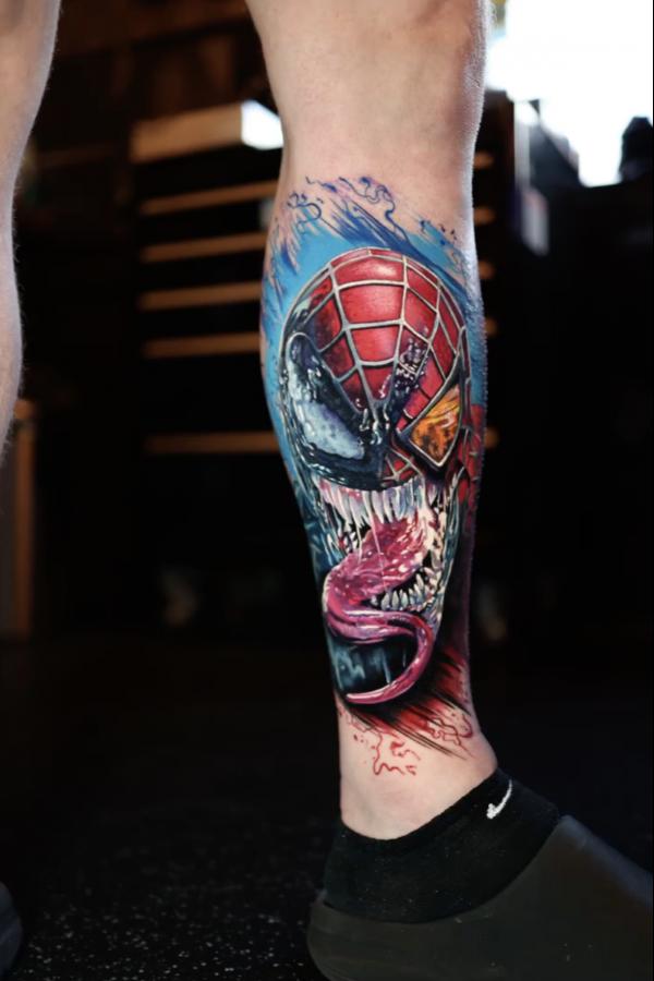 Spiderman venom lower leg tattoo