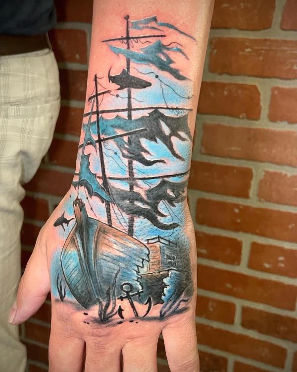Sunken ship hand tattoo