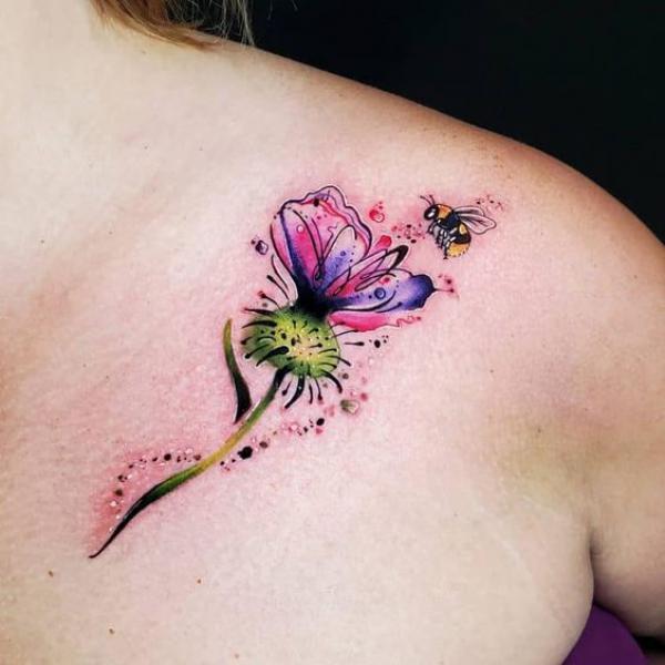 Thistle and bee clavicle tattoo
