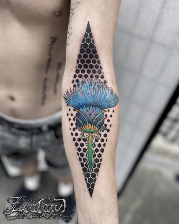 Thistle and honeycomb tattoo