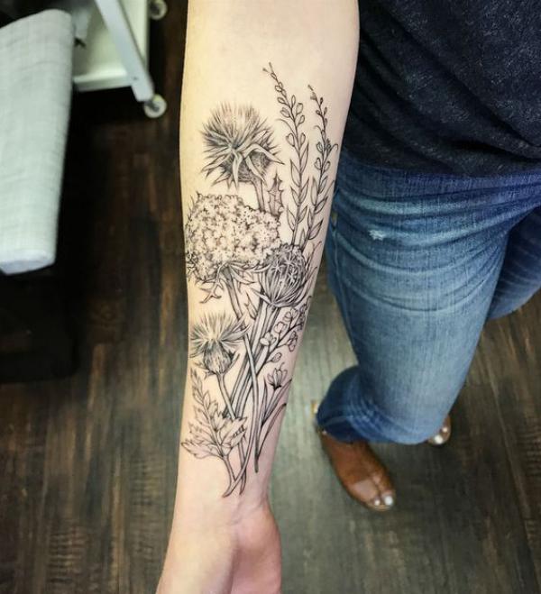 Thistle and wild carrot tattoo black and grey