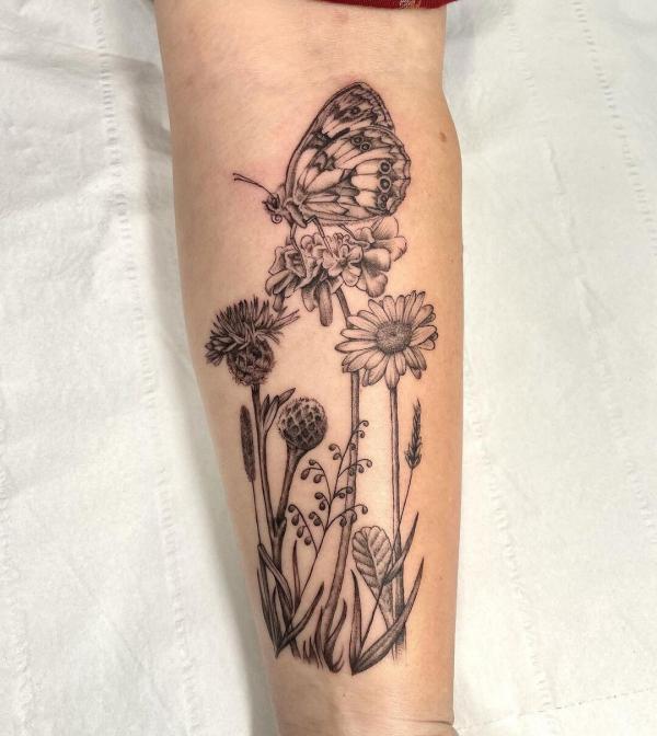 Thistle daisy and marigold with butterfly tattoo
