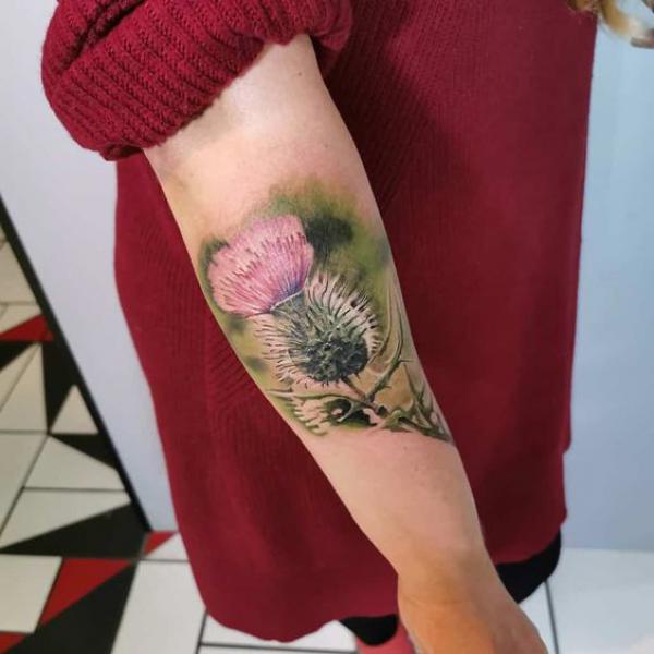 Thistle elbow tattoo