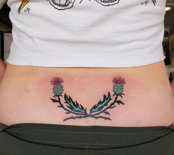Thistle low back tattoo