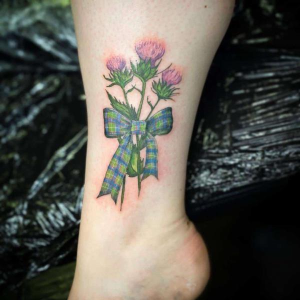 Thistle with bow ankle tattoo