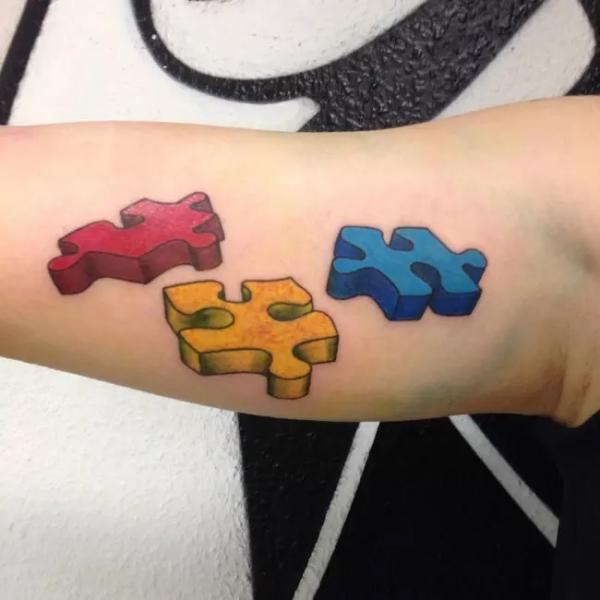 Three 3D puzzle tattoo