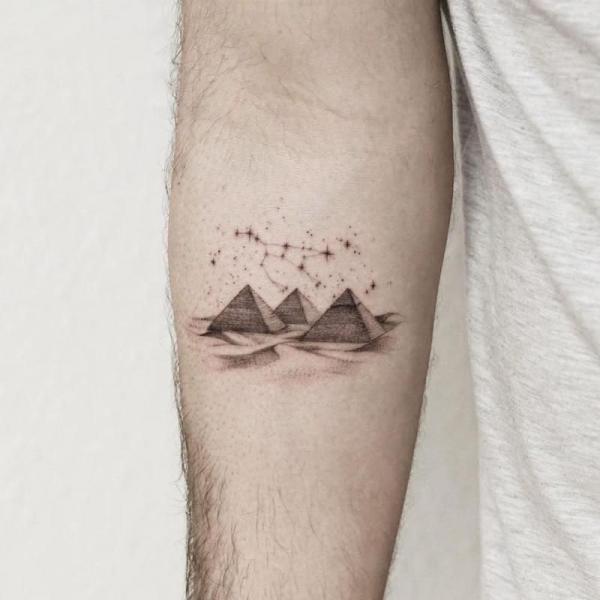 Three pyramids with constellation map tattoo