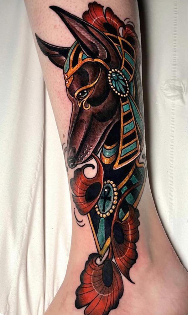 Traditional Anubis lower leg tattoo