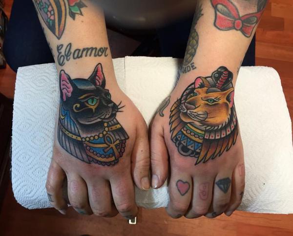 Traditional Bastet and Sekhmet tattoo on hands